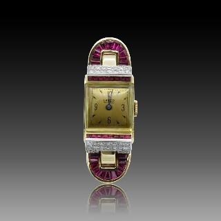 Montre Dame vers 1950 jonc en Or 18k avec Rubis et Diamants.