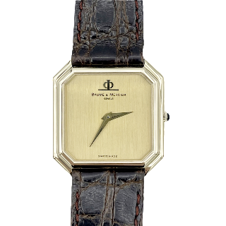 Montre Baume & Mercier Vintage Rectangulaire  Or jaune 18k mécanique Vers 1970.