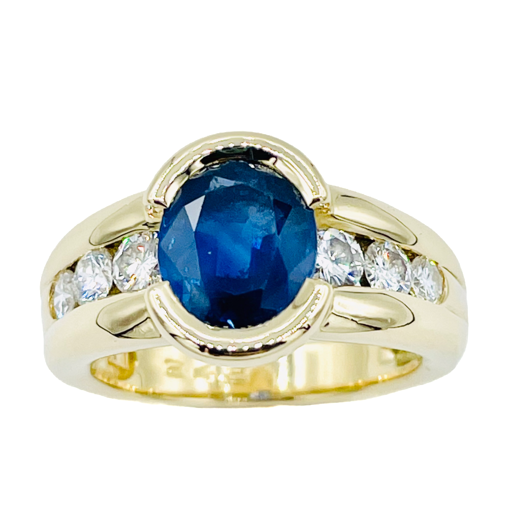 Bague Or jaune 18k avec un Saphir ovale et Diamants brillants . Taille 54