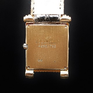 Montre Boucheron "Reflet"  grand modèle à quartz en or jaune 18k .