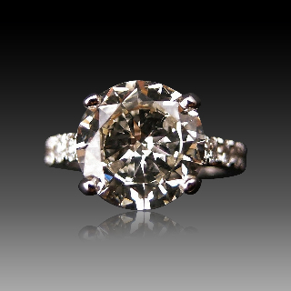 Solitaire en or gris 18k avec Diamant brillant 3.04 Cts M-VS1 + 0.30Cts.