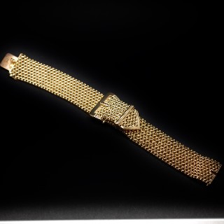 Montre Bracelet Ceiture signée Rolex vers 1960 en or rose 18k mécanique.