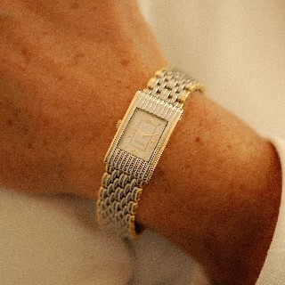 Montre Boucheron "Reflet" de Dame Petit modèle à quartz en or et acier de 2004.