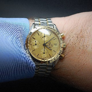  Montre Omega SpeedMaster Or et Acier Chronographe Automatique vers 1998.