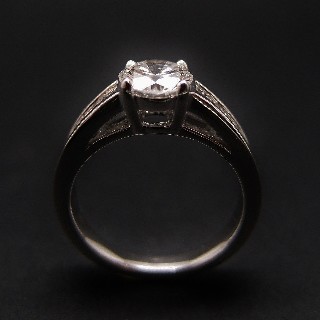 Solitaire Diamant brillant 1.07 Cts E-VS2 en Or 18 Cts + 0.36 Cts.