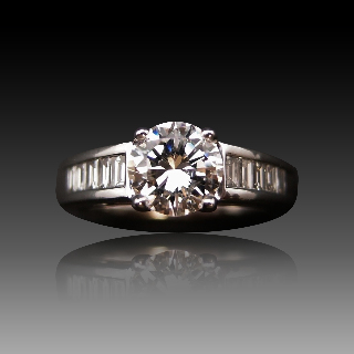 Solitaire Diamant brillant 1.07 Cts E-VS2 en Or 18 Cts + 0.36 Cts.