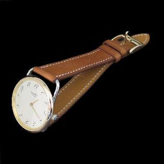 Montre Hermes "Arceau" Or et Acier . Quartz. 33 mm.