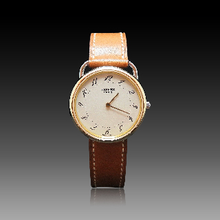 Montre Hermes "Arceau" Or et Acier . Quartz. 33 mm.