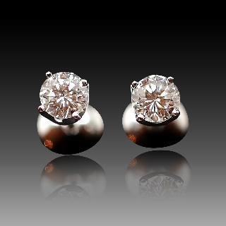 Puces d'oreilles Or gris 18k avec 2 Diamants brillants 0.50 Cts et 0.46 Cts. F et VS2/SI1