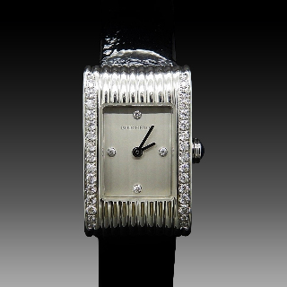 Montre Boucheron "Reflet" de Dame petit modèle acier et Diamants .