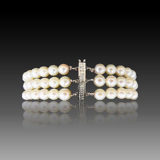 Bracelet de Perles de Culture 3 rangs 6.0 mm Or gris 18 k . 19 cm.