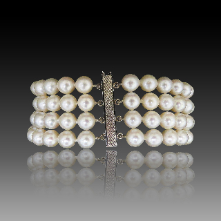 Bracelet de Perles de Culture 4 rangs 6.7 mm Or gris 18 k . 18 cm.