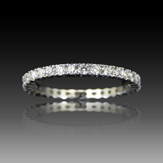 Alliance or gris 18K avec 0.76 Cts Diamants G-VS . Taille 54.