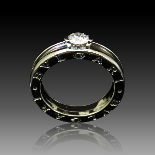 Solitaire Bulgari en Or Gris 18 Cts modèle "B-Zero" Diamant 0.30 Cts E-VVS2 .Taille 51.  