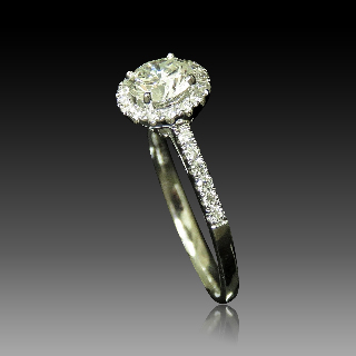 Solitaire en Or gris 18 Cts avec Diamant brillant 0.66 Cts K-VS1 + 0.24 Cts.