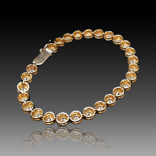 Bracelet ligne en or jaune 18 Cts avec 27 diamants H/VS  Total : 6.8 Cts