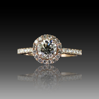 Solitaire en Or rose 18 Cts avec Diamant brillant 0.60 Cts I-SI1 + 0.24 Cts.