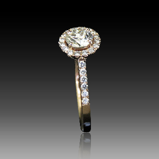 Solitaire en Or rose 18 Cts avec Diamant brillant 0.60 Cts I-SI1 + 0.24 Cts.