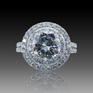 Solitaire en Or gris 18 Cts avec Diamant brillant 2.34 Cts F-VS1 + 1.04 Cts.