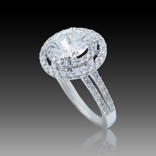 Solitaire en Or gris 18 Cts avec Diamant brillant 2.34 Cts F-VS1 + 1.04 Cts.