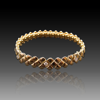 Bracelet Fred "matelassé" or jaune 18 carats et diamants vers 1980