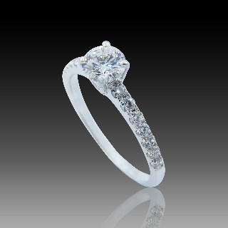 Solitaire Diamant brillant 0.51 Cts G-P1 en Or 18 Cts + 0.30 Cts.
