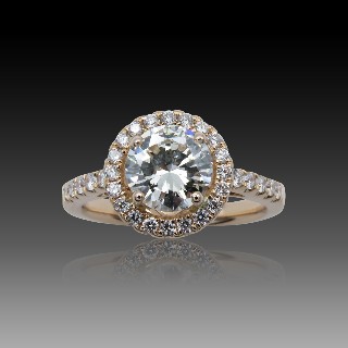 Solitaire en Or rose 18 Cts avec Diamant brillant 1.26 Cts J-SI1 + 0.35 Cts.