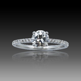 Solitaire Diamant brillant 0.67 Cts G-VS2 en Or 18 Cts + 0.16 Cts.