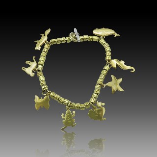 Bracelet DODO avec breloques en Or Jaune 18k et argent  30,30 gr