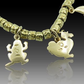 Bracelet DODO avec breloques en Or Jaune 18k et argent  30,30 gr