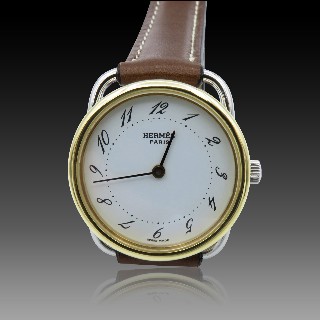 Montre Hermes  dame "Arceau" Or et Acier . Quartz. 25 mm.