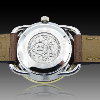 Montre Hermes  dame "Arceau" Or et Acier . Quartz. 25 mm.