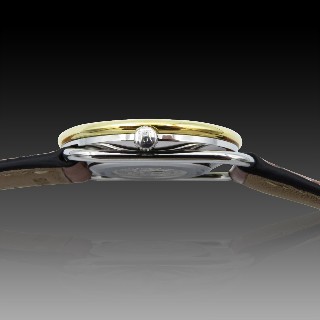 Montre Hermes  Dame "Arceau" Or et Acier . Quartz. 30 mm.