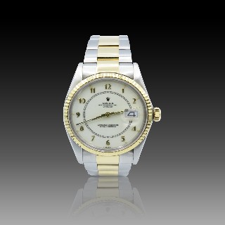 Montre Rolex Oyster Datejust en Or jaune 18k et Acier de 1983 . Montre Rolex Oyster Datejust en Or jaune 18k et Acier de 1983 .