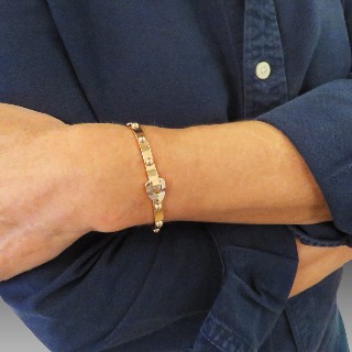 Bracelet jonc ouvrant Vuitton "Clou" or rose 18k . Poids : 31,20 Grs.Taille 16