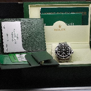 Montre Rolex Submariner Sea Dweller Acier de 2006.  Boite-Papiers.  