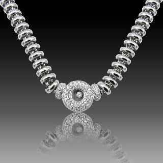 Collier Pendentif Chopard "Happy Diamonds" en or gris 18k et diamants brillants.