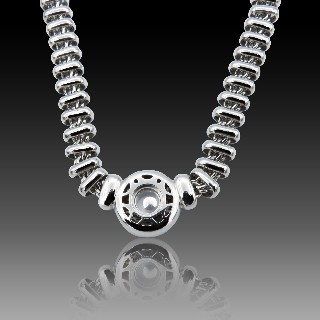 Collier Pendentif Chopard "Happy Diamonds" en or gris 18k et diamants brillants.