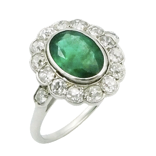 Bague "Marguerite" en Platine Emeraude et diamants .vers 1920 . Taille 53