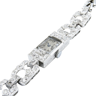 Montre dame Art Déco en platine avec 2,50 Cts de diamants . Montre dame Art Déco en platine avec 2,50 Cts de diamants .