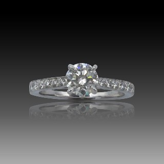 Solitaire en Or gris 18 Cts avec Diamant brillant 0.76 Cts K-VS1 + 0.10 Cts.