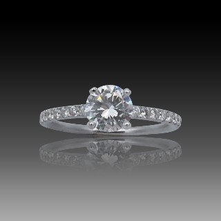 Solitaire en Or gris 18 Cts avec Diamant brillant 0.72 Cts D-VS1 + 0.21 Cts.