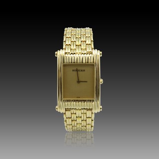 Montre Boucheron "Reflet"  homme grand modèle à quartz en or jaune 18k .