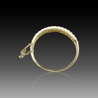 Bracelet Jonc ouvrant  en Or 18k avec Rubis et Diamants.