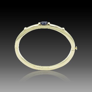 Bracelet Chaumet rigide ouvrant Or jaune 18k "GIOIA" avec Iolite . 