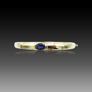 Bracelet Chaumet rigide ouvrant Or jaune 18k "GIOIA" avec Iolite . 