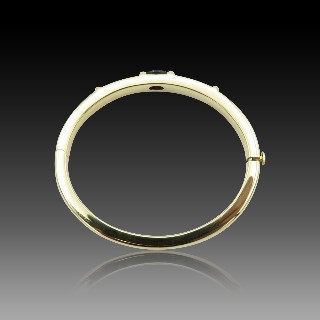 Bracelet Chaumet rigide ouvrant Or jaune 18k "GIOIA" avec Iolite . 