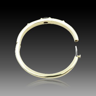 Bracelet Chaumet rigide ouvrant Or jaune 18k "GIOIA" avec Iolite . 