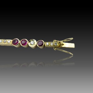 Bracelet articulé en or jaune 18 Cts avec Diamants et Rubis