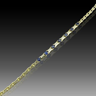 Bracelet articulé en or jaune 18 Cts avec Diamants et Saphirs